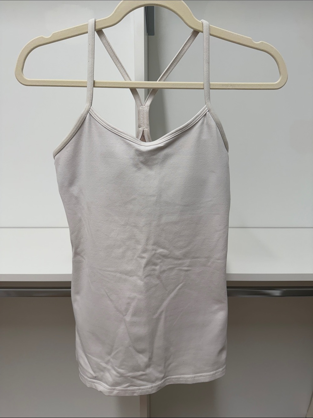 Lululemon white Power Y tank. Size 6. Good condition. Very minor pilling.